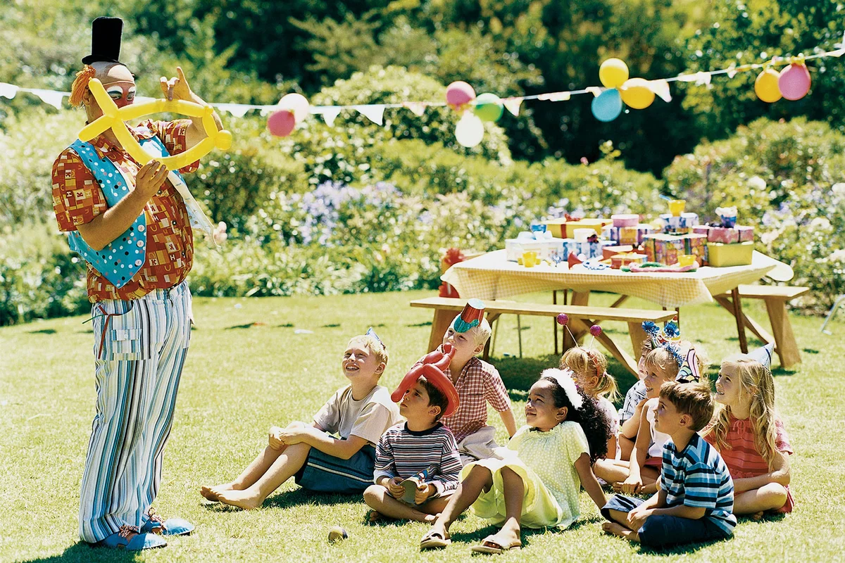 backyard Carnival party with clown making balloons