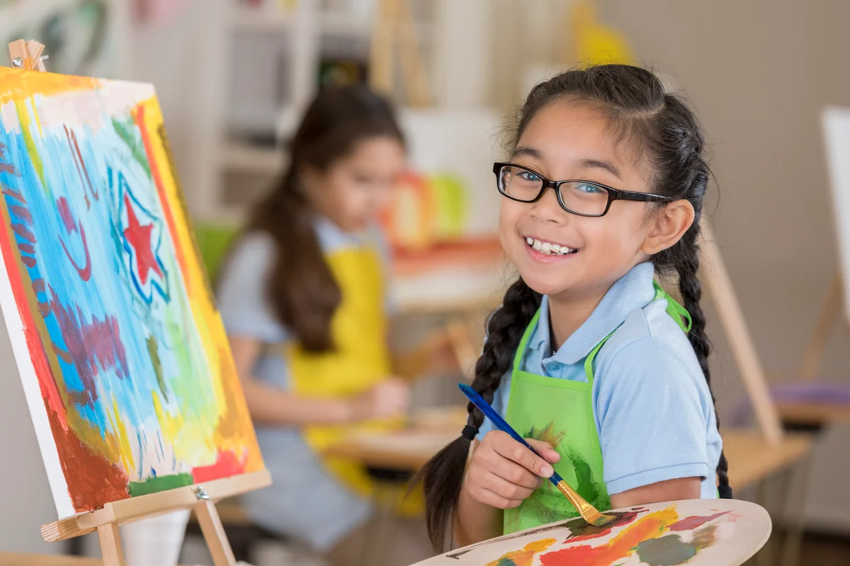 girl painting at art studio birthday party