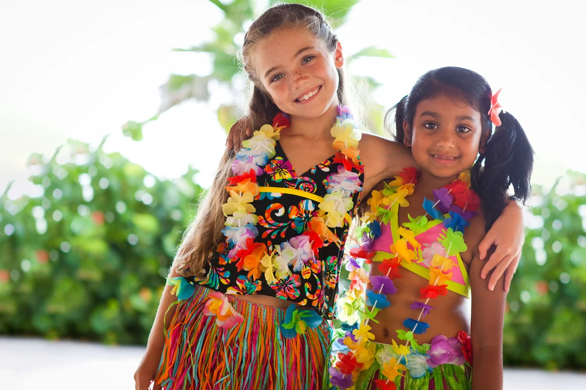two girls at luau theme birthday party