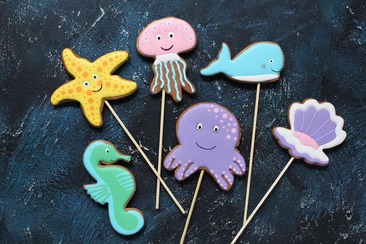 Homemade gingerbread cookies in the shape of octopus, shell, jellyfish, starfish, seahorse and whale