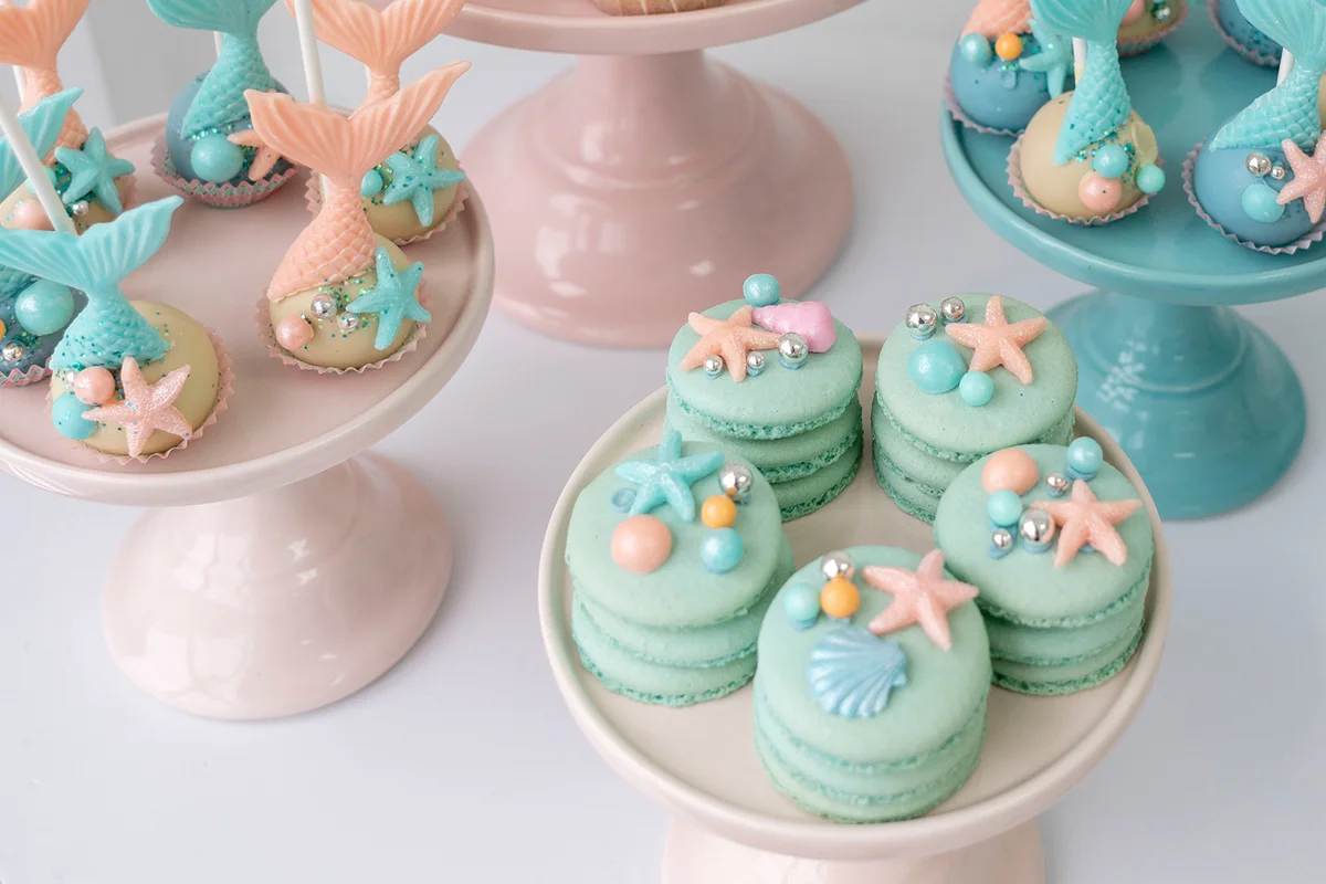 Mermaid macarons and cookies in pink and turquoise colors