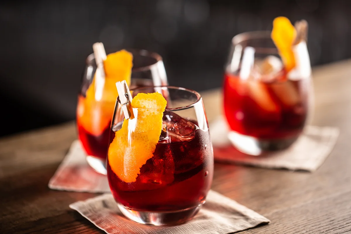 Negroni Variations with orange garnish