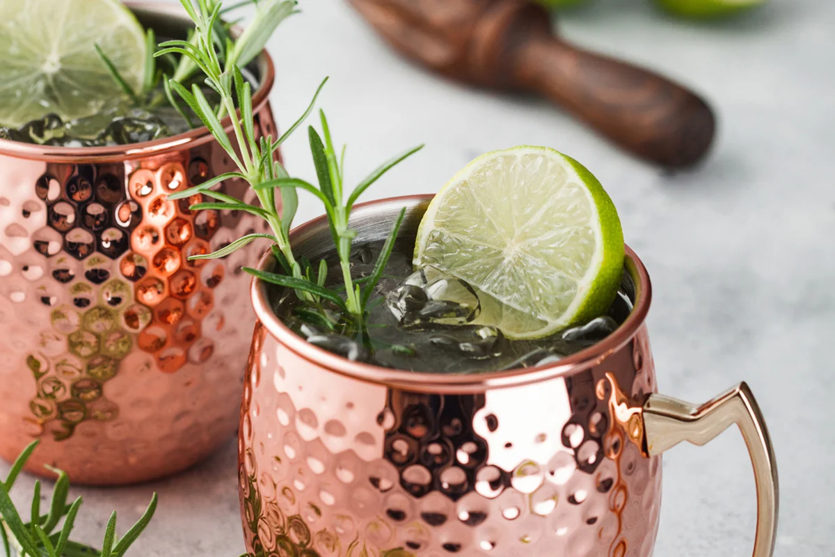 Rosemary Kentucky Mule in a copper mug with lime and rosemary
