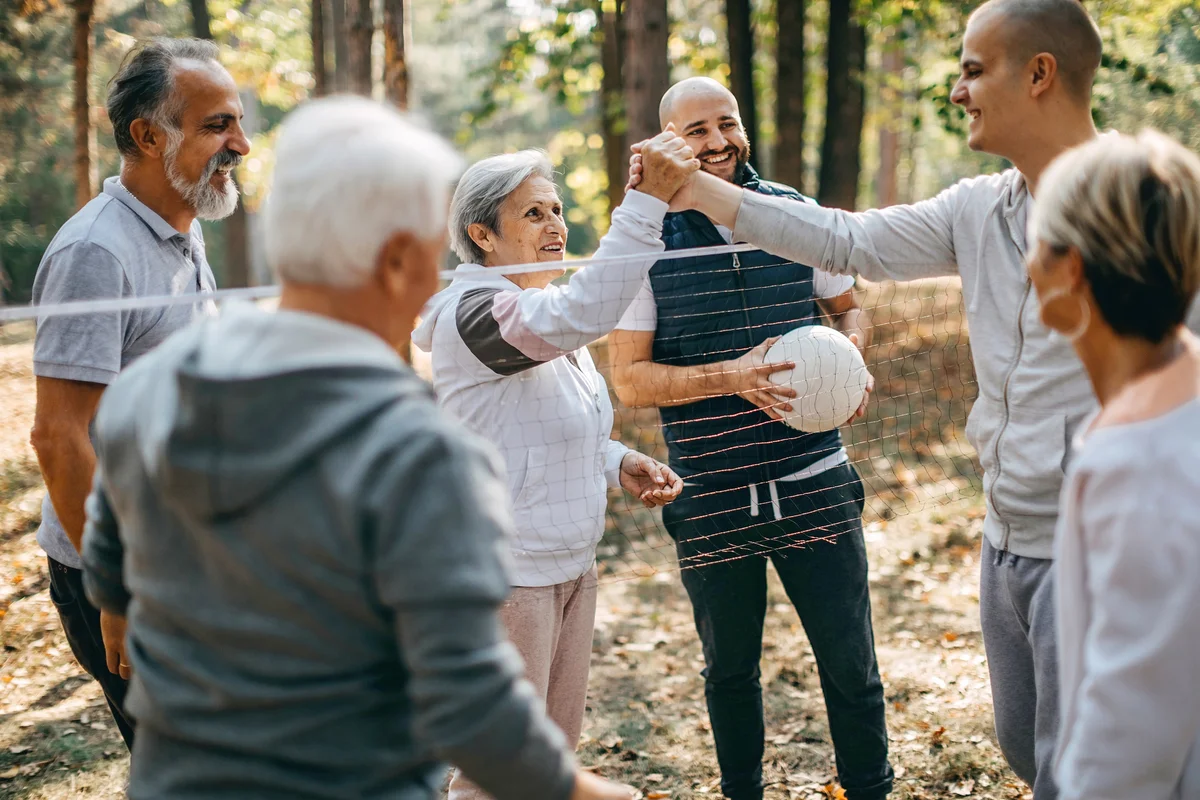 Multigenerational family plays volleyball