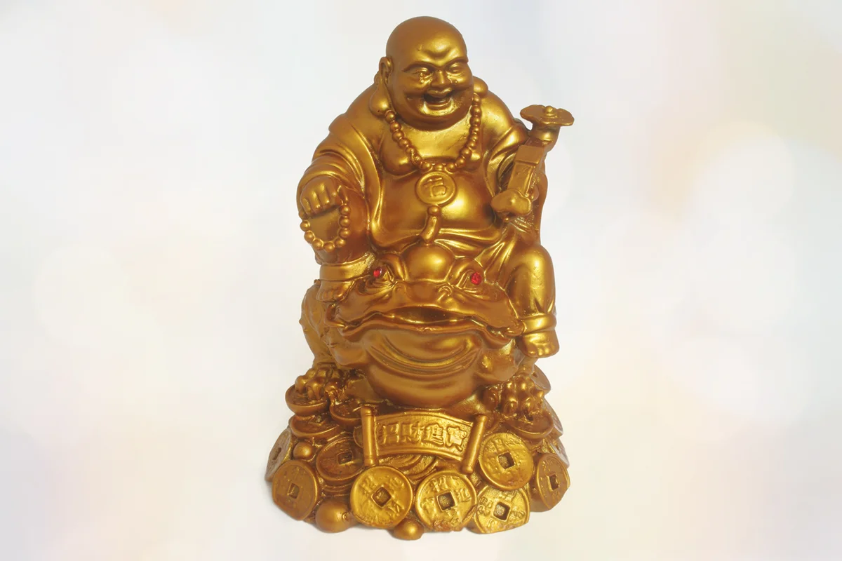 Laughing Buddha statue riding frog