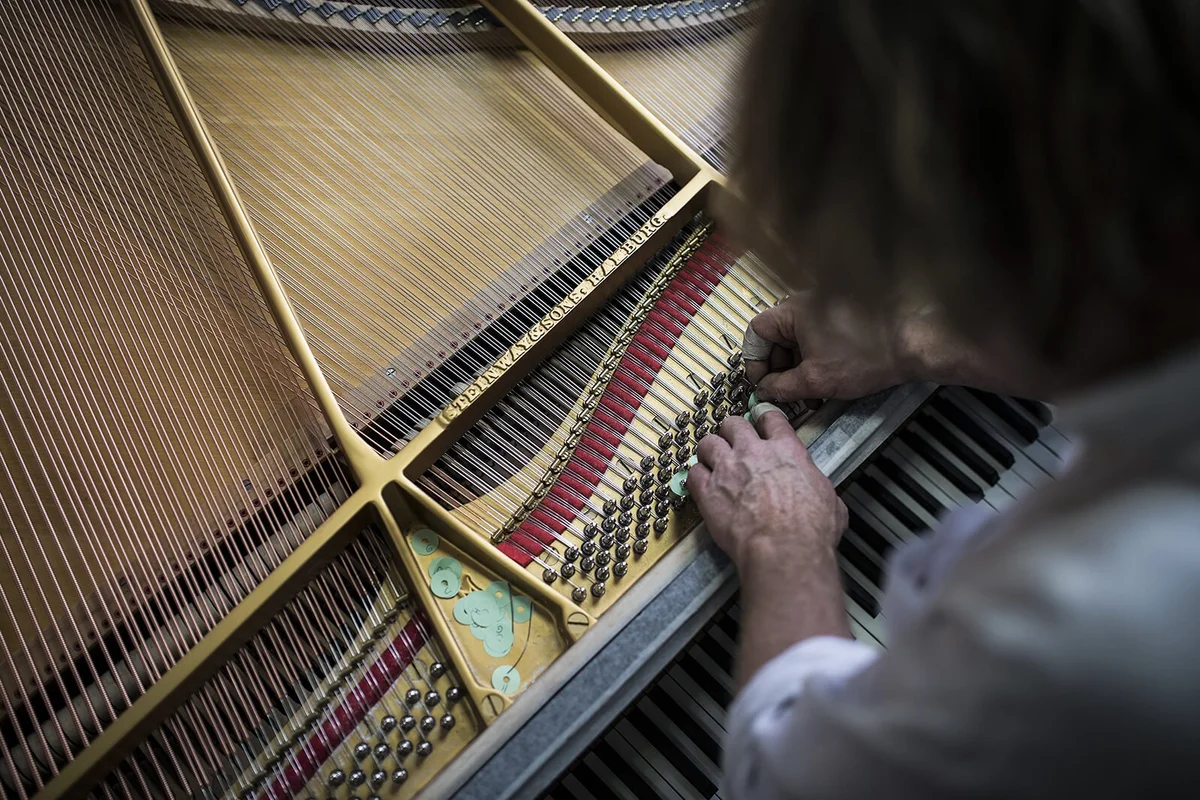 Experienced piano renovator Joel Jobe in Ankara State Conservatory in Turkey | Getty Editorial Use