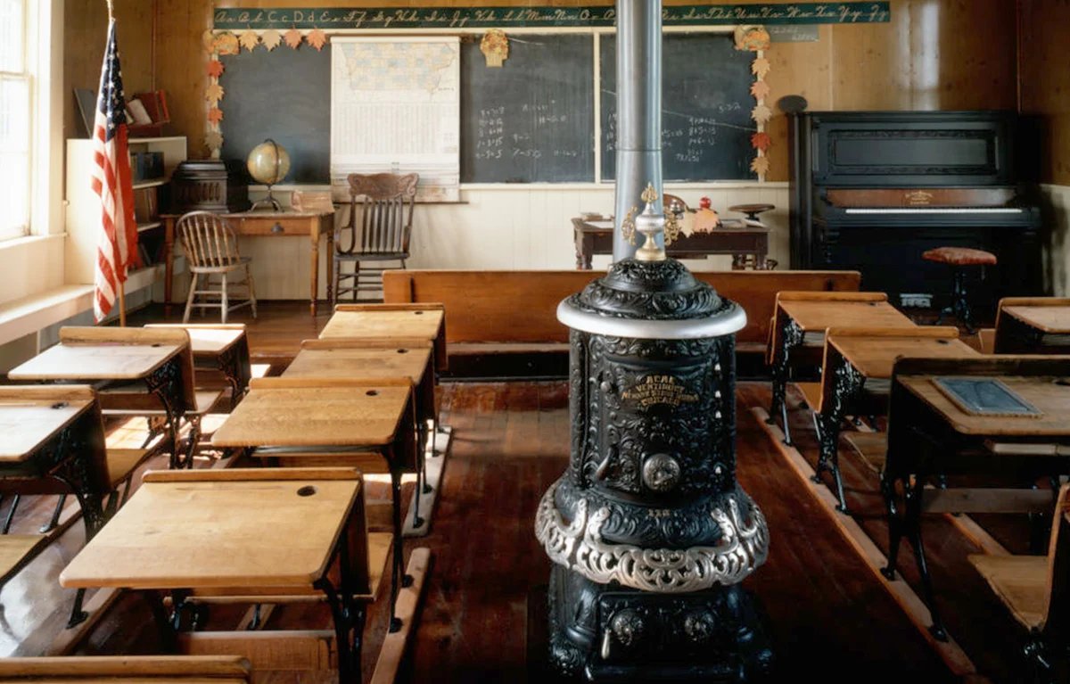 old school house classroom with desks