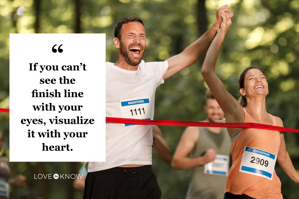 Happy athletic couple crossing the finish line