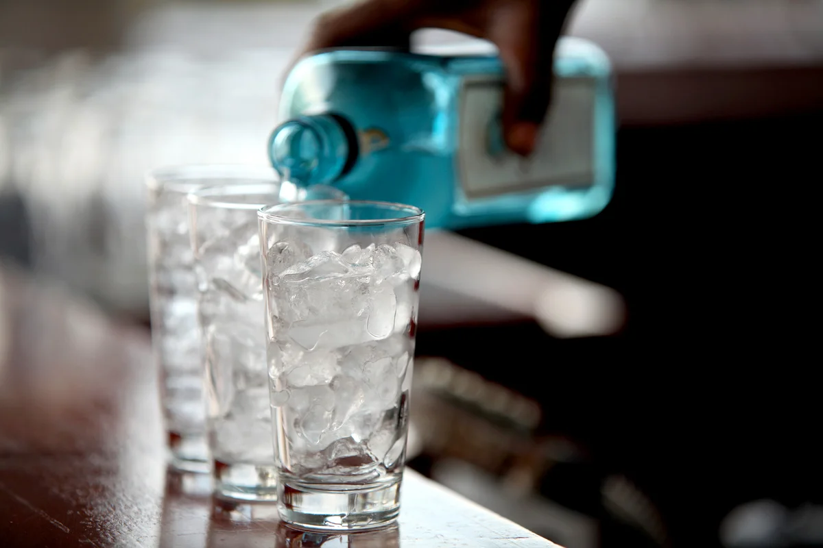 Pouring gin at a bar