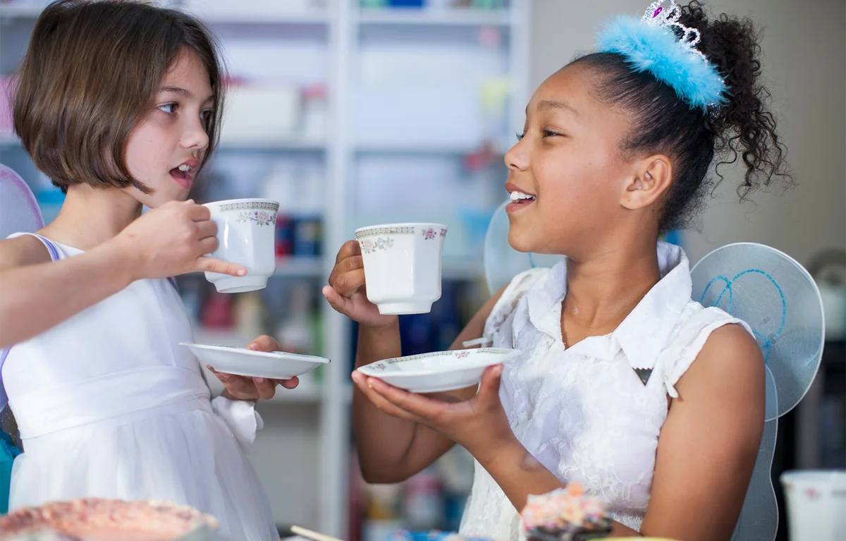 two girls having a tea party