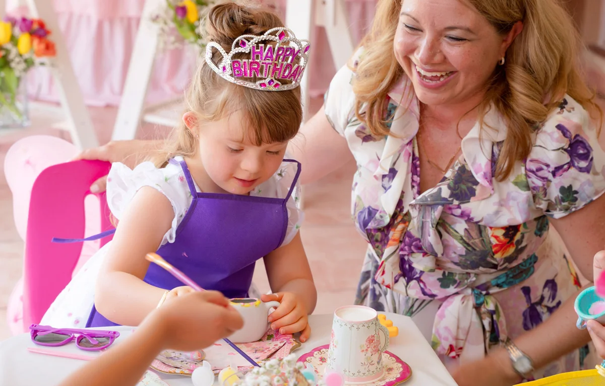 girl painting teapot at birthday tea party craft