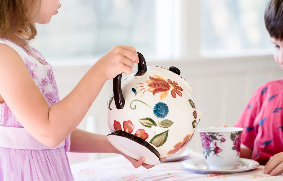 girl pouring tea for guest
