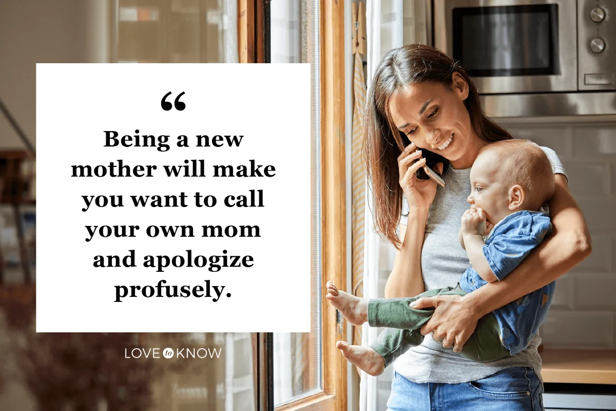 Smiling mother with baby talking on phone at home