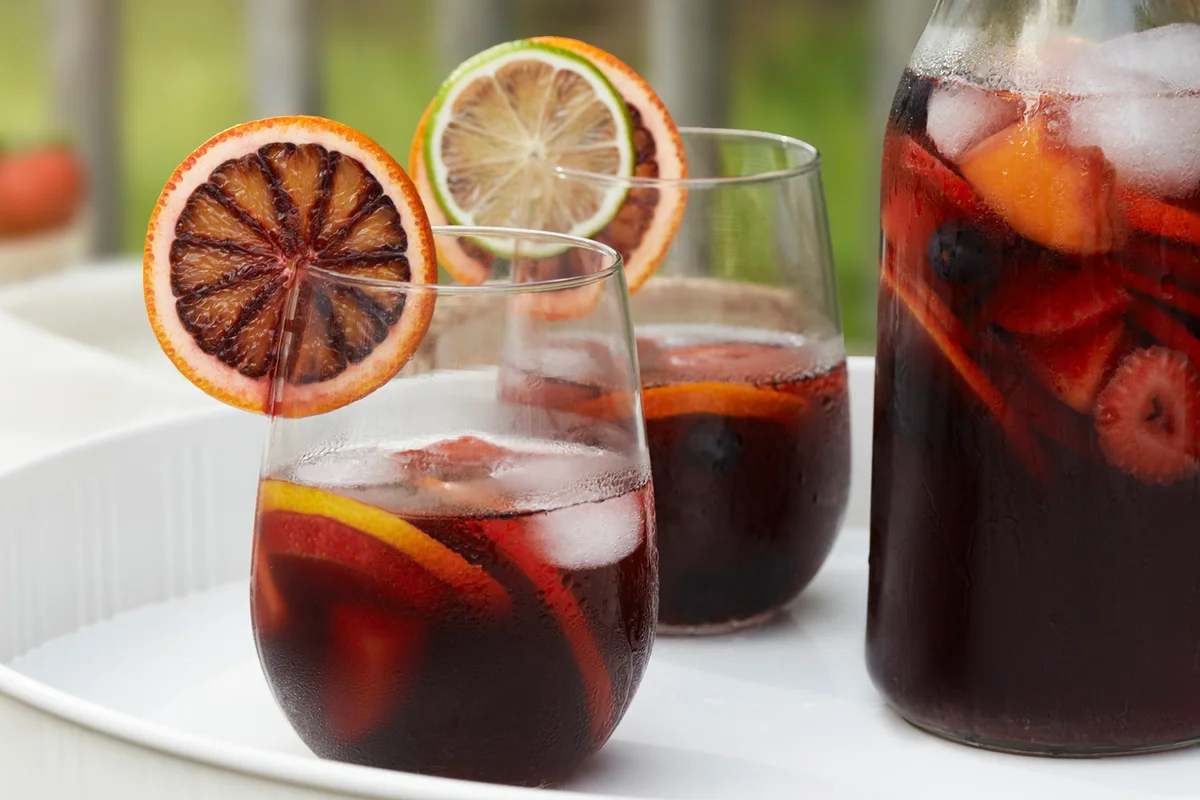 Red Wine Sangria pitcher and glasses full with ingredients
