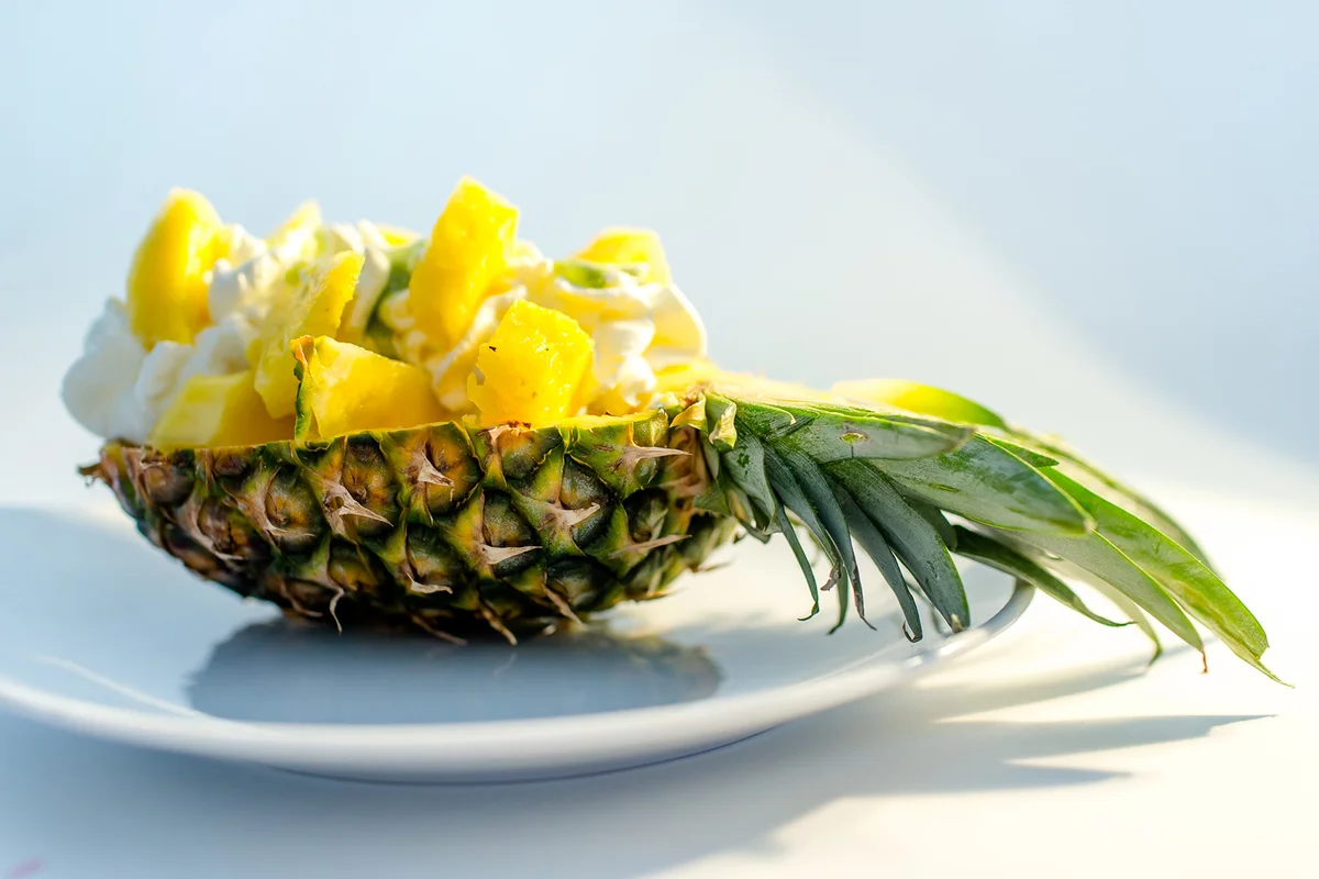 Pineapple Bowl with ice-cream and whipped Cream