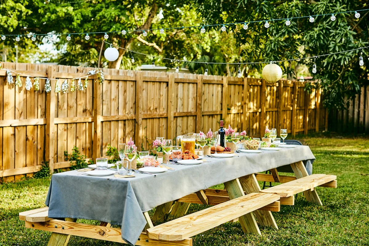 Place setting on dining table in back yard