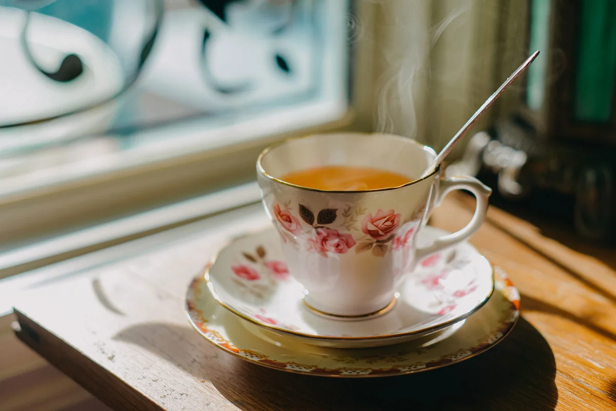 rose design teacup with hot tea