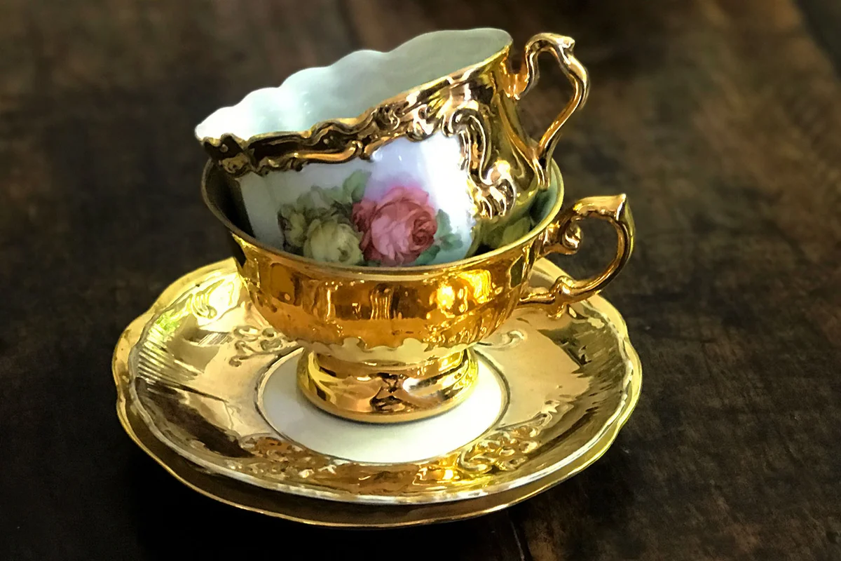 gold teacup and saucer