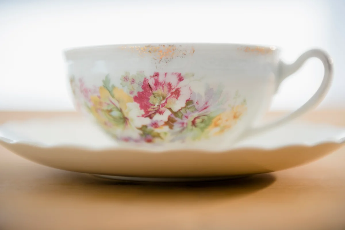 close up of antique teacup and saucer