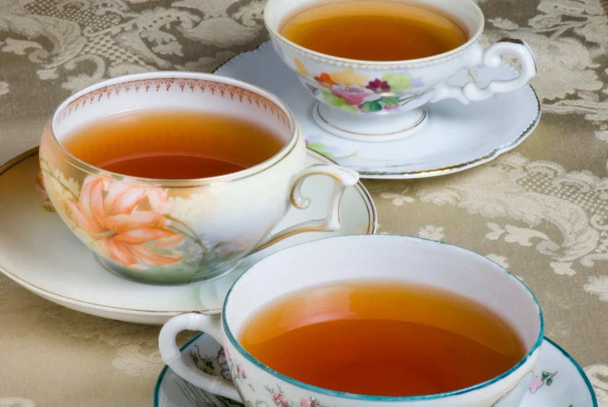 teacups on lace tablecloth