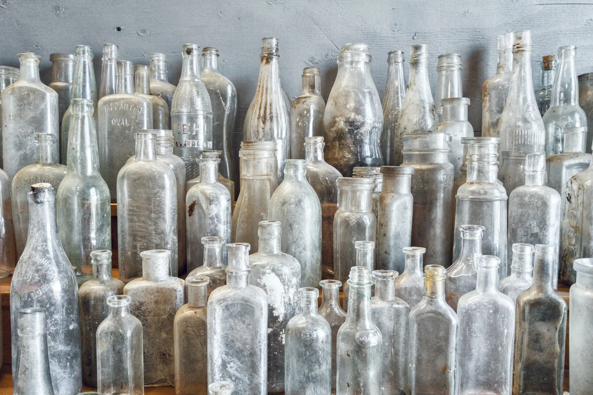 old bottle lined up on table