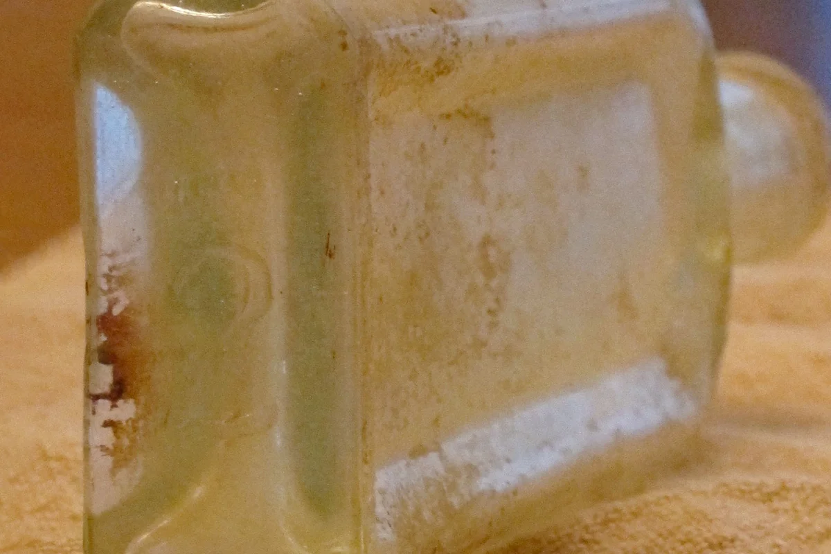 bottom of antique bottle with makers mark