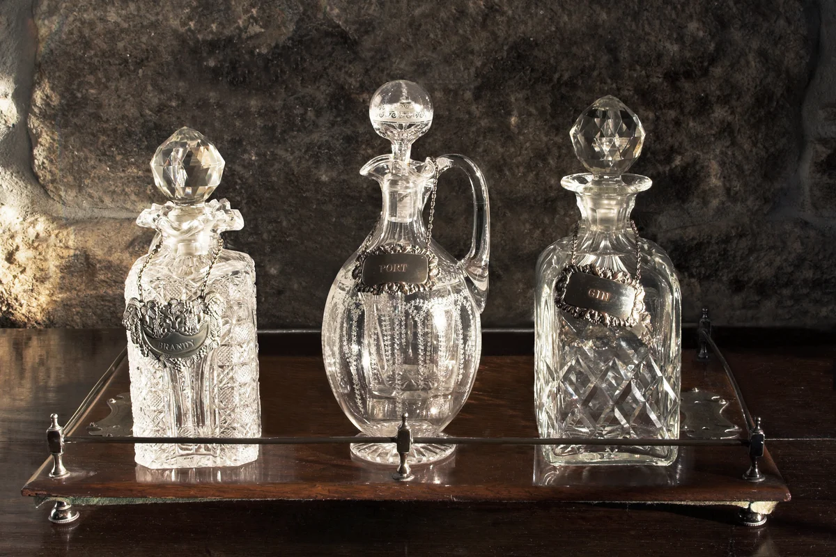 Antique Glass Decanters On Wooden Tray