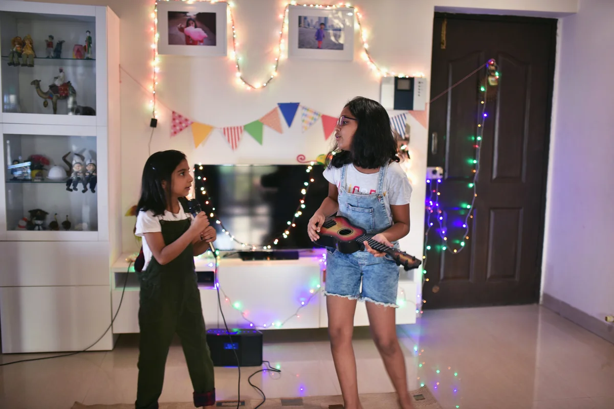 Girls performing a song at home