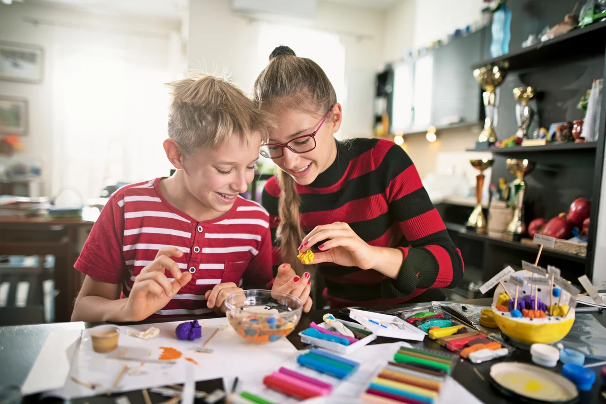 Brother and sister making biological cell model