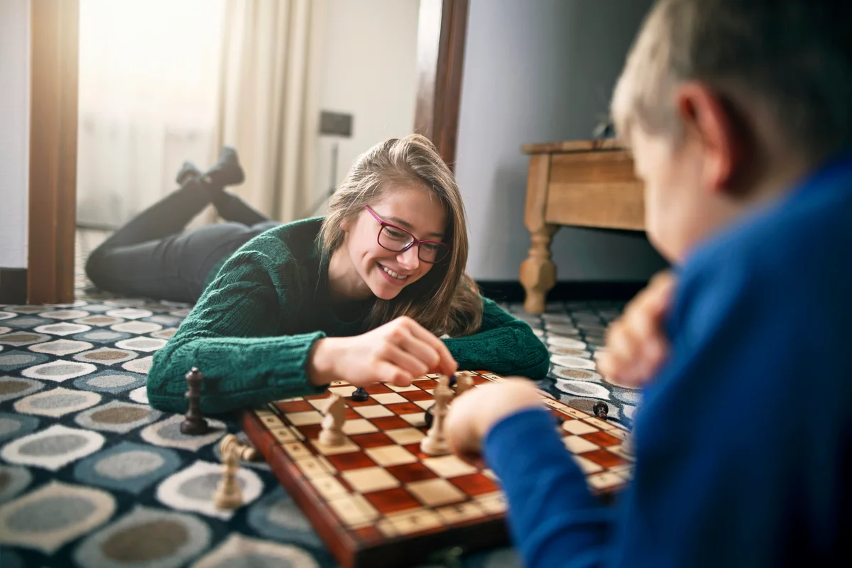 Brother and sister playing chess
