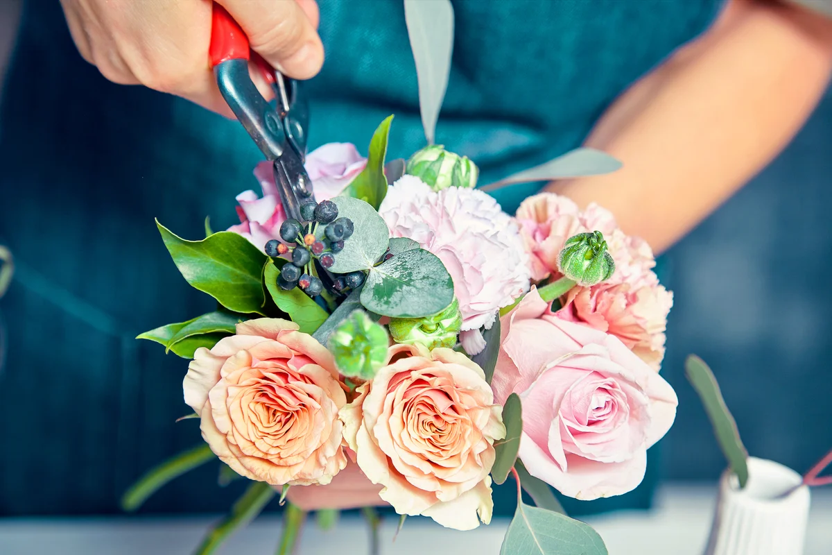 Woman cut bunch for making decorations and arrangements