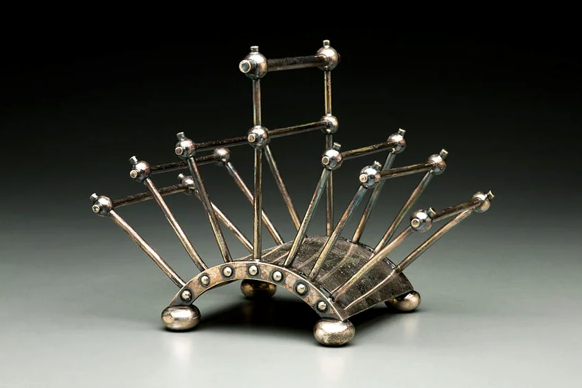 Articulated toast rack, by British artist Christopher Dresser