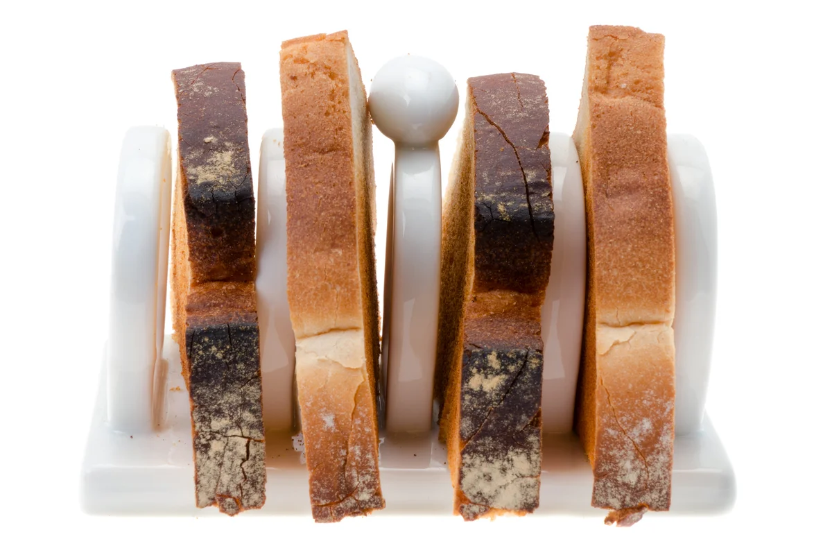 Toasted slices of bread in a white china toast rack