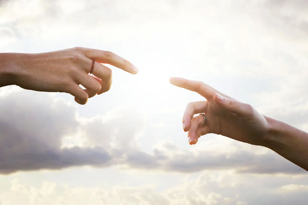 two hands reaching towards each other as fate