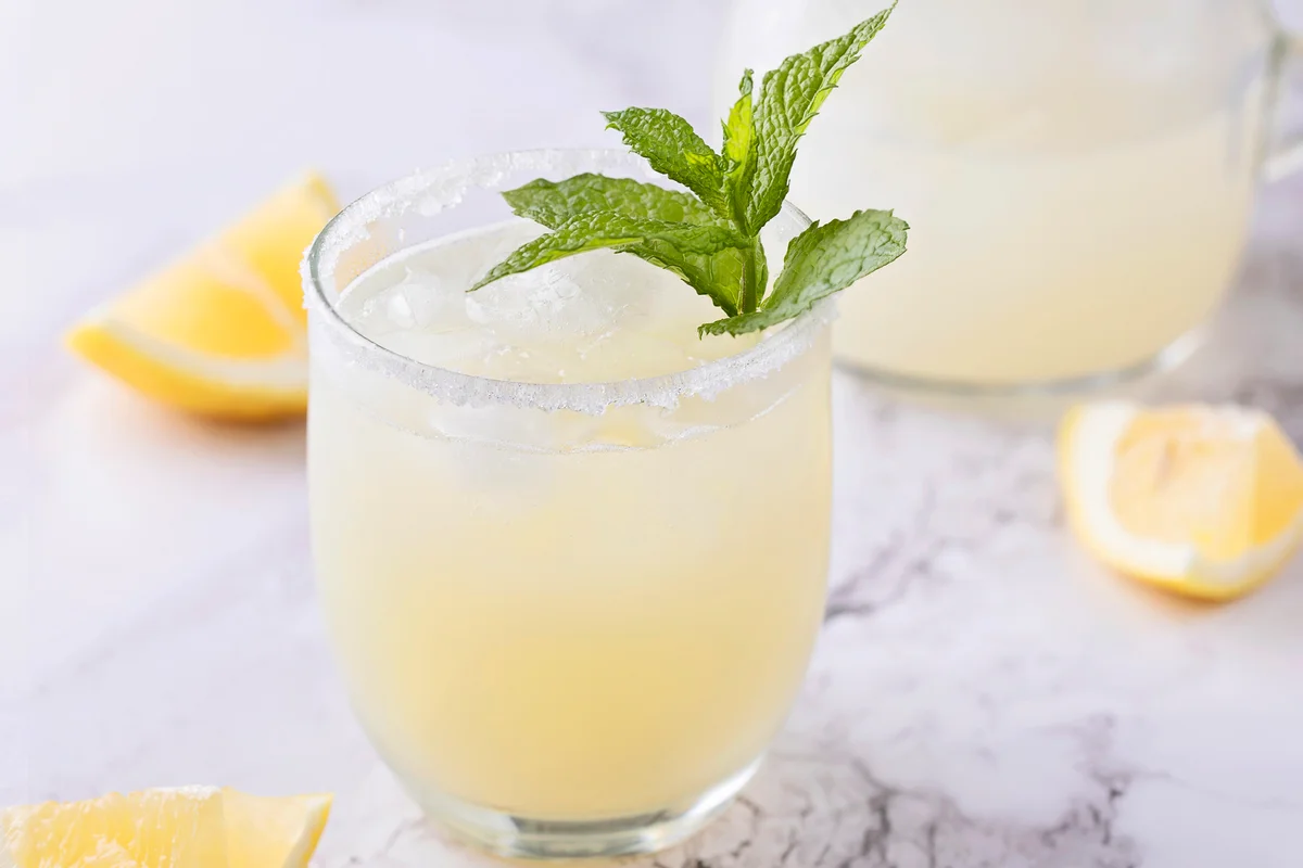 Glass of homemade lemonade on marble surface