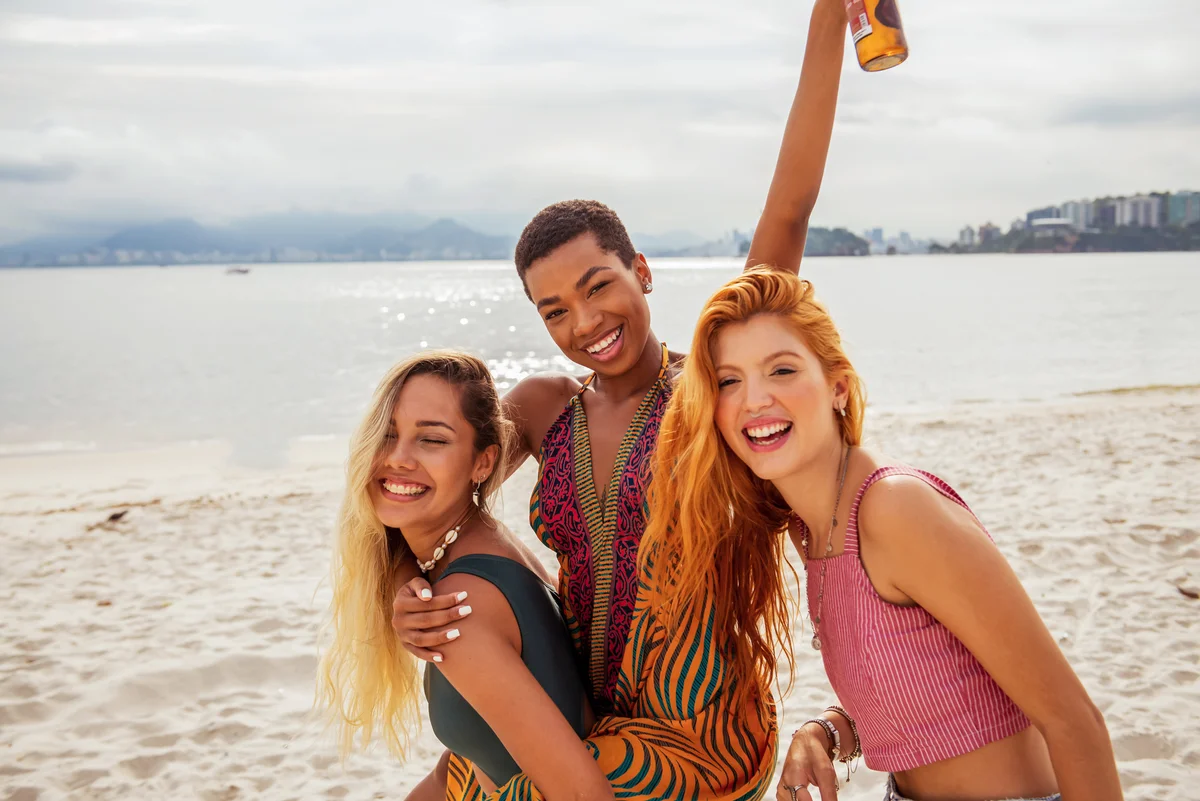 girlfriends having fun at beach birthday celebration