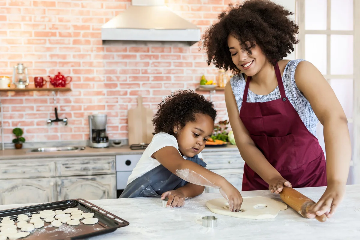mother and daughter cooking together