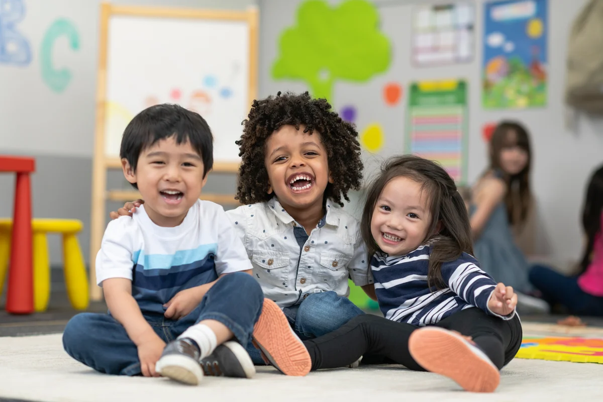 laughing toddler friends at preschool