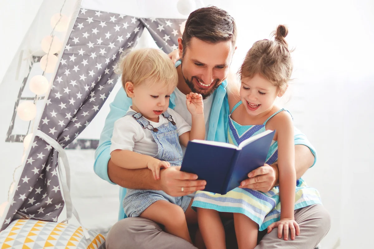 father reading to children