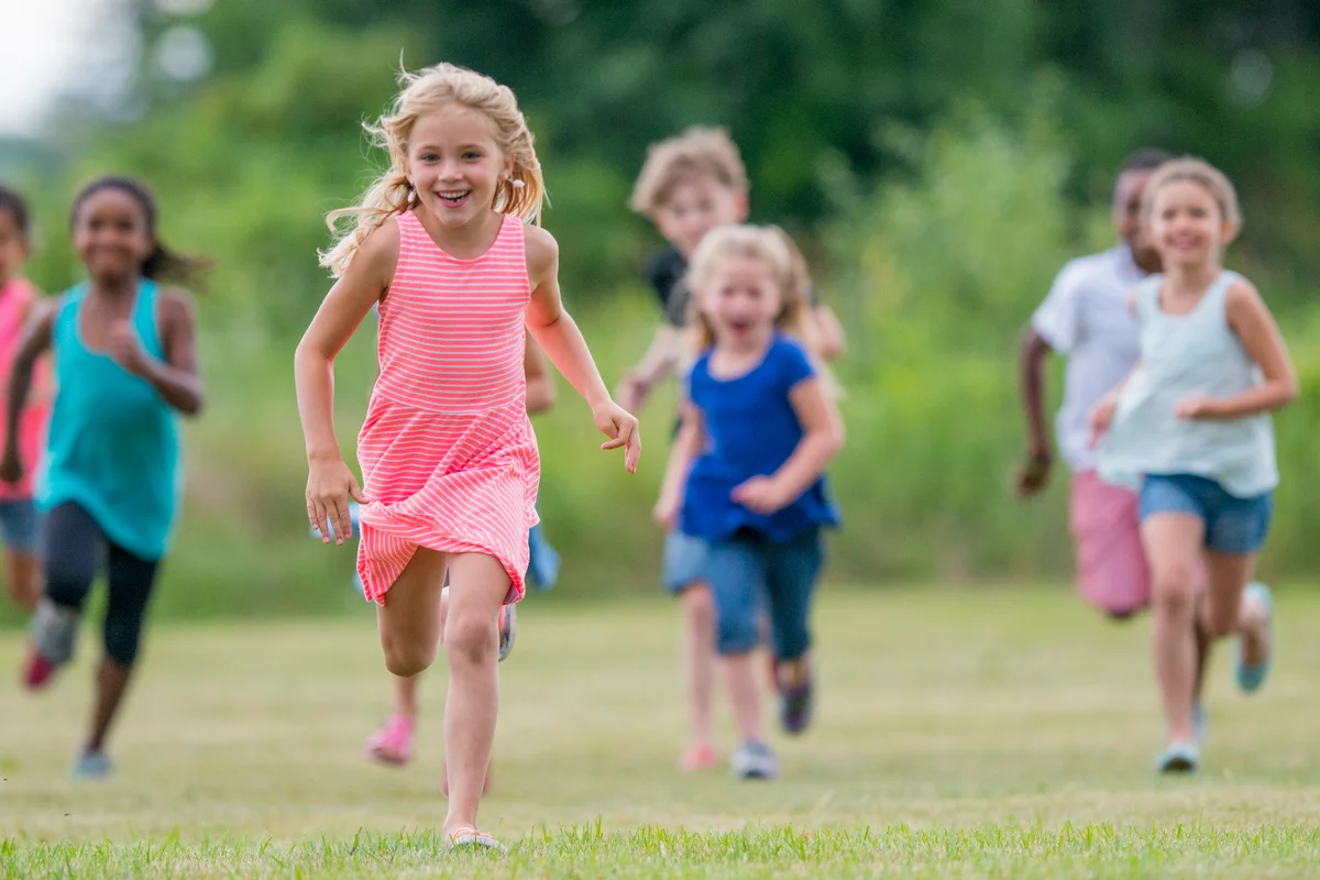 children running in a line sharks and minnows game