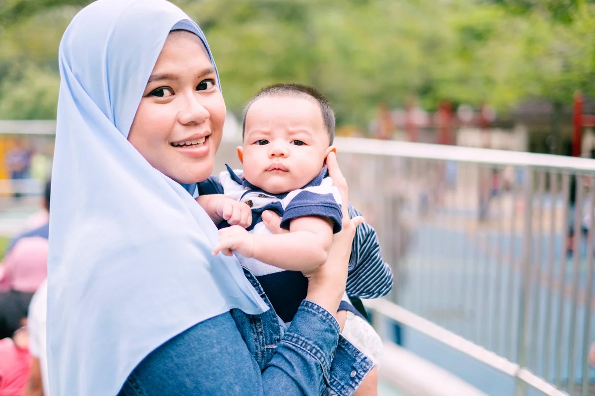 Malaysian Woman with Her Cute Newborn Baby Boy