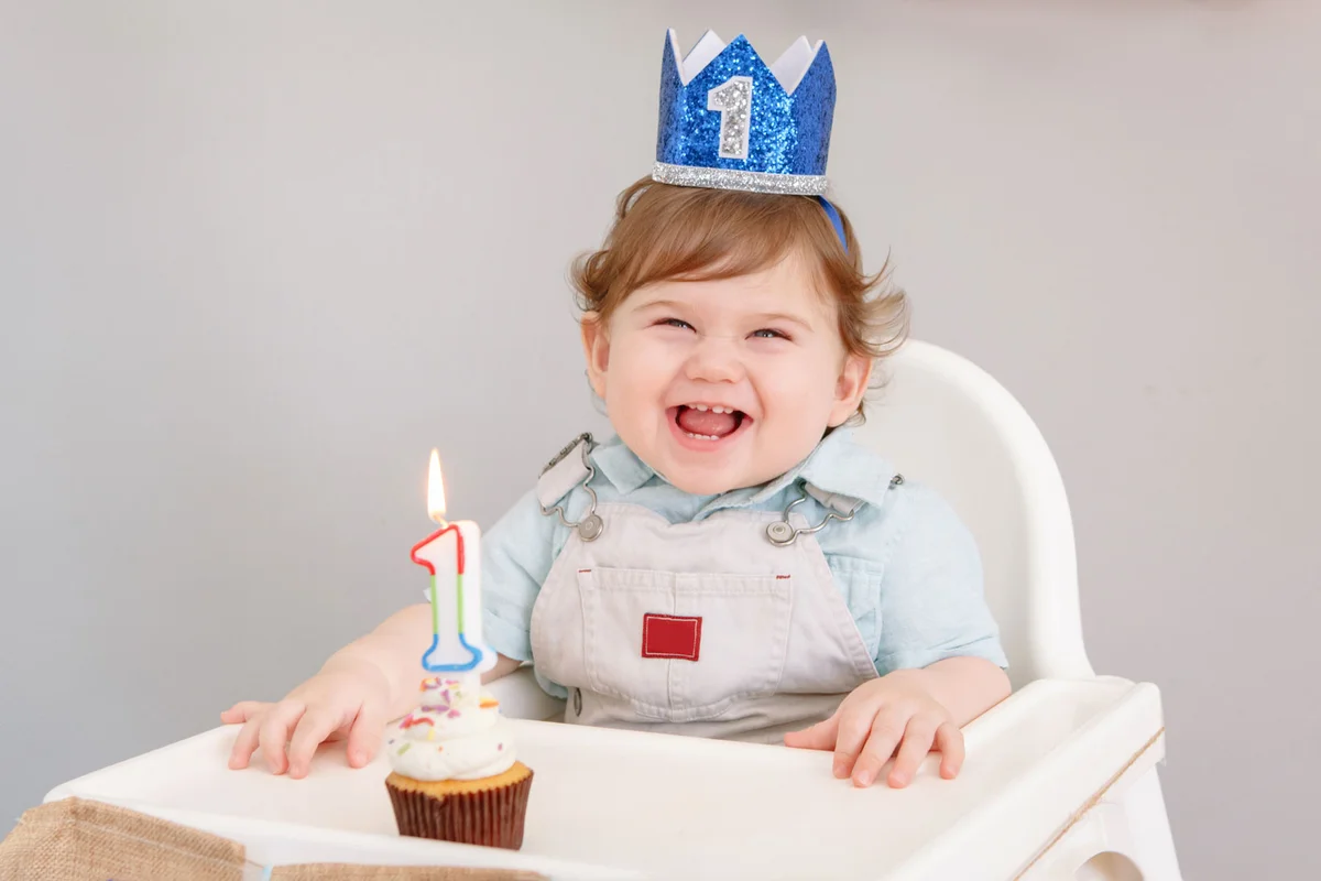 happy one year old boy celebrating his birthday