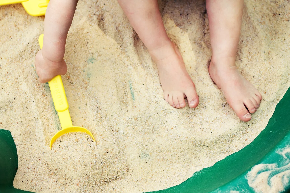 baby in sandbox