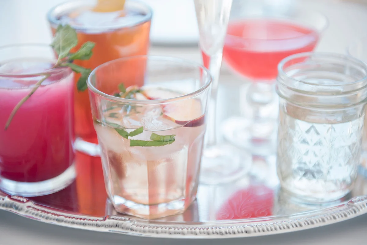 Cocktails in glasses on tray