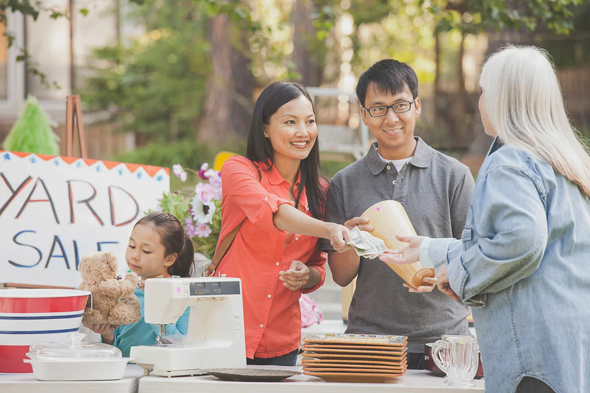 family shopping at yard sale