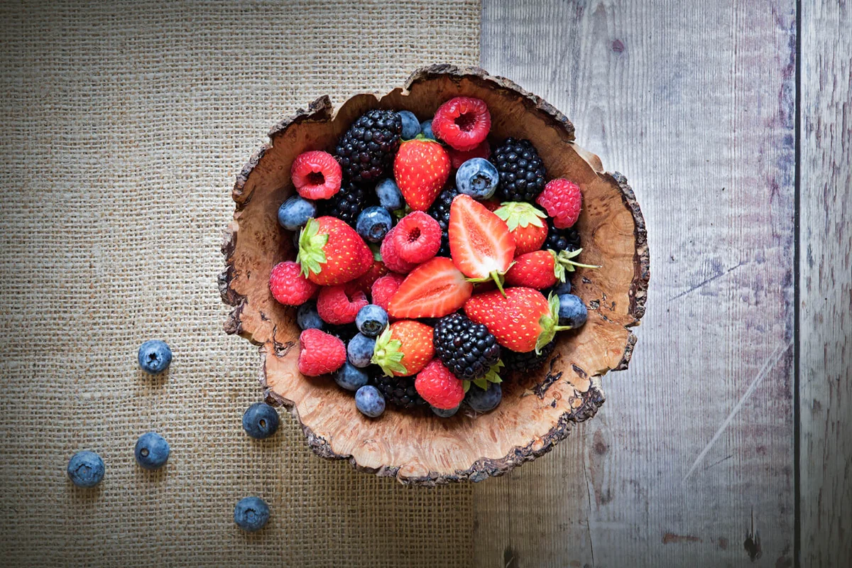 wooden bowl full of Healthy Summer berries