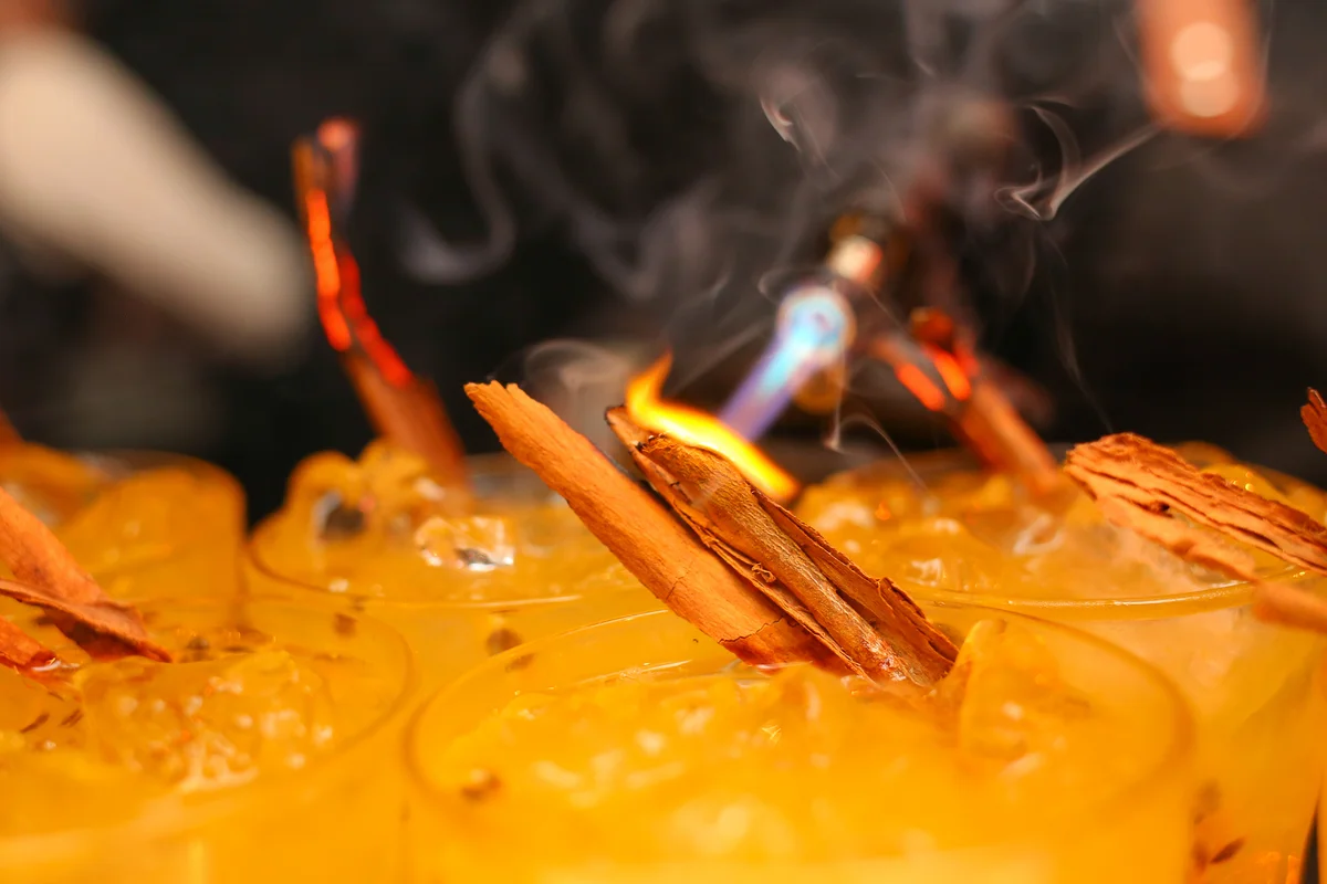 charred cinnamon stick for cocktail garnish