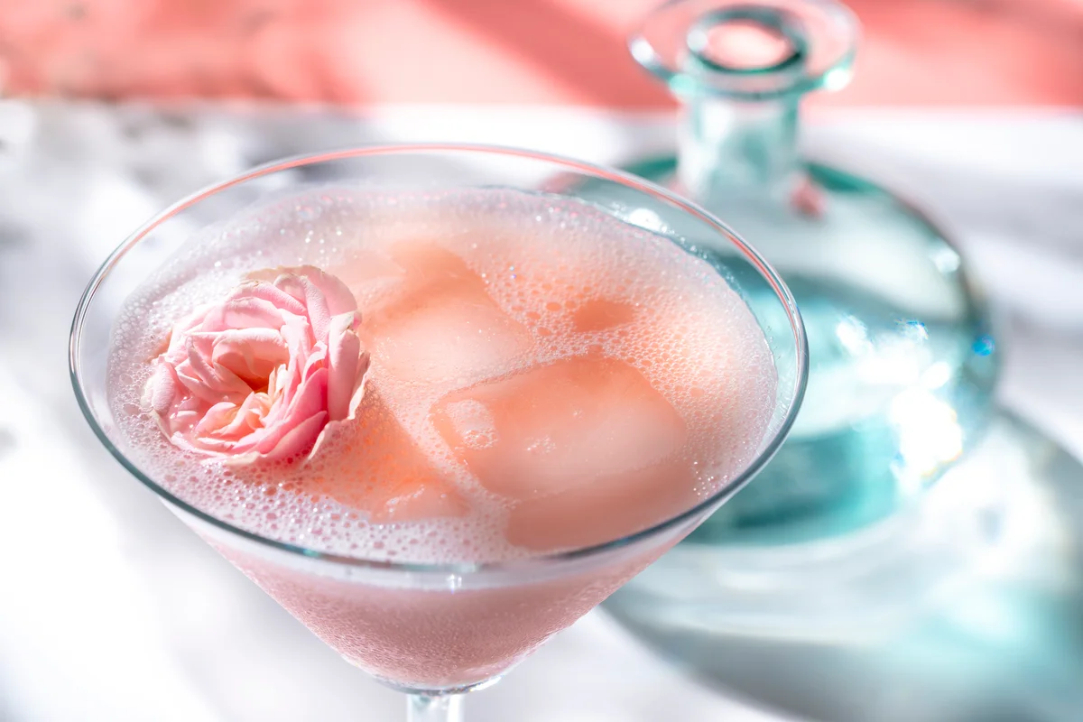 rose garnish in cocktail