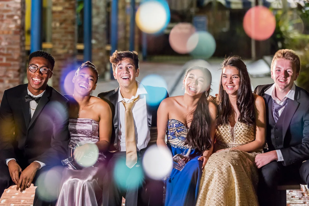 Three couples hanging out after prom