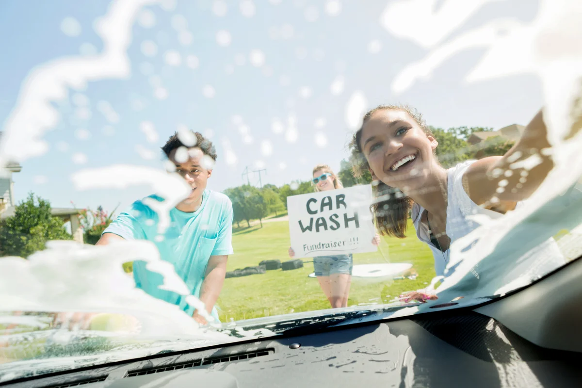 Teenagers wash cars for fundraiser